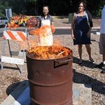 The barrel has air holes strategically placed to allow oxygen to feed the fire.