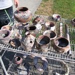 The firing process takes approximately 4-5 hours. The kiln is allowed to cool somewhat before the pieces are removed with gloves and tongs. True results are not apparent until the debris is brushed off the pieces. The surface is further enhanced by applying a liquid polymer that seals the surface and enriches many of the subtle colors achieved during the firing.