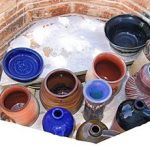 One of the unique characteristics of this type of firing (wood-salt firing) is a natural salt glaze on the raw clay surface. The colors in this photo are from normal glazes, the exteriors have areas of a random, unpredictable pattern of the clay color and the orange-ish salt glaze that occurred by the introduction of the salted wood stoking.