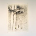 Three charcoal and pastel drawings on paper on wall. On left, an owl on the ground beside a telephone pole; middle a squirrel lies dead on the street; on right, a small cat also laying in the street with a flower hovering above it.