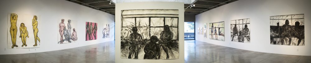 Panorama view of art in gallery, showing 4 large scale drawings of human figures on the left wall, a charcoal drawing of 3 children reading by window in the center, and on the right wall: 2 large charcoal drawings of figures, one large oil painting, and 4 framed watercolors.