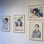 Four framed watercolors hang on gallery wall, each with a portrait of a member of the artist's family