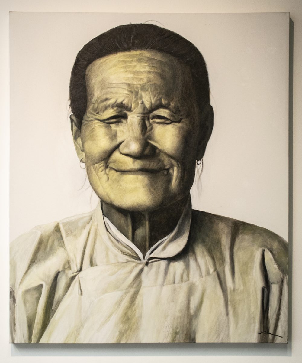 A painting of an older Asian woman in traditional clothing, with her hair pulled away from her face. The portrait is in sepia tones, highly photorealistic, and depicts just her head and shoulders, with her face looking directly at the viewer.