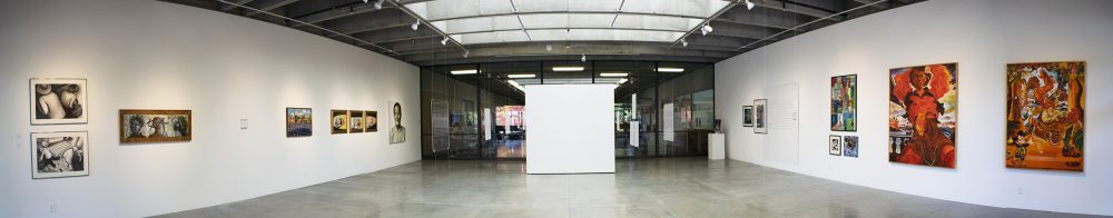 Panorama installation view of gallery with seven wall mounted artworks on the left and seven wall mounted artworks on the right. At center is a blank white wall and in the middle of the room are clear acrylic panels suspended from the ceiling. A video monitor is on a pedestal in the far right corner.