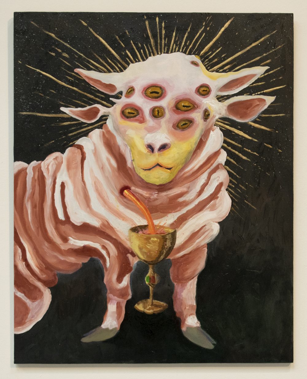 : Oil painting of a mythical animal that has the head and hooves of a sheep, but has two pairs of ears and eight eyes across its forehead. The animal faces the viewer directly, showing its head, front legs and torso, but the rear legs are not seen. A wound on its chest pours orange blood into a golden chalice. Gold rays eminate from its head. The animal is painted in shades of pink, white and yellow and is set on a black background.