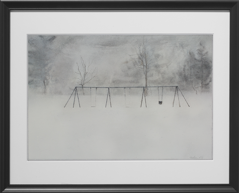 Landscape drawing with black frame. The charcoal drawing is of a swing set in a field of snow. In the foreground of the drawing is white snow. The middle ground depicts three empty swings, with the legs of the structure (drawn as upside down V shapes) in between them and on either end of the structure. In the background are trees. The drawing is in subtle black and white tones and the overall mood of the piece is stillness and quiet.