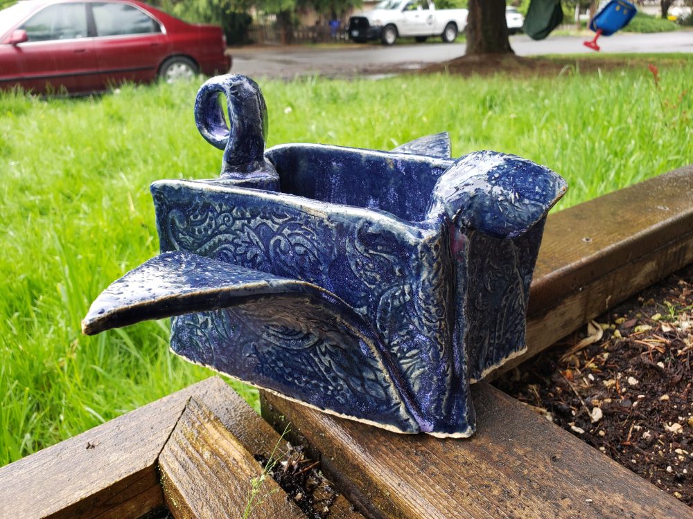 Dora Morin, Origami Crane, 2019, recycled clay, 5.5" x 12.25" x 8"