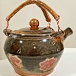 Leila Piazza, Earthen Teapot, 2020, mac-10 clay fired at cone 10, copper wire, 7" x 6.5" x 6.5"
