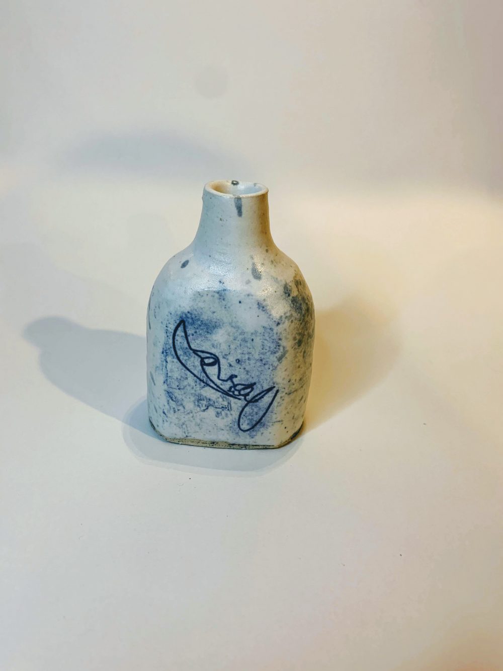 Shania Sweet, The Woman in the Bottle, 2020, wheel throwing clay, glaze, and laser glaze etching, 3.5 "x 2.5" x 1.75"
