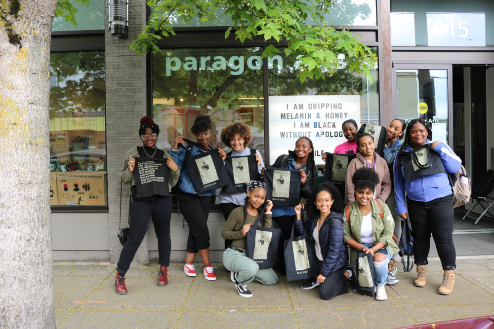 students in front of marquee and gallery window in 2019