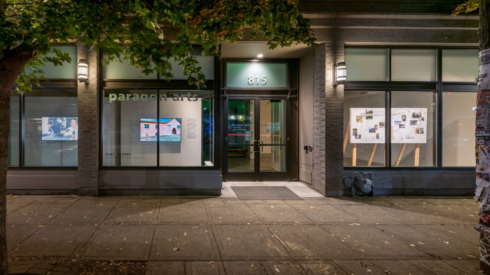 Window view with details of Rami George, Untitled (Samaritan Foundation), 2014. HD video, color, sound, 5:46 min., and Untitled (mapping), 2020, inkjet print, wood, 84 x 96 x 28 in.