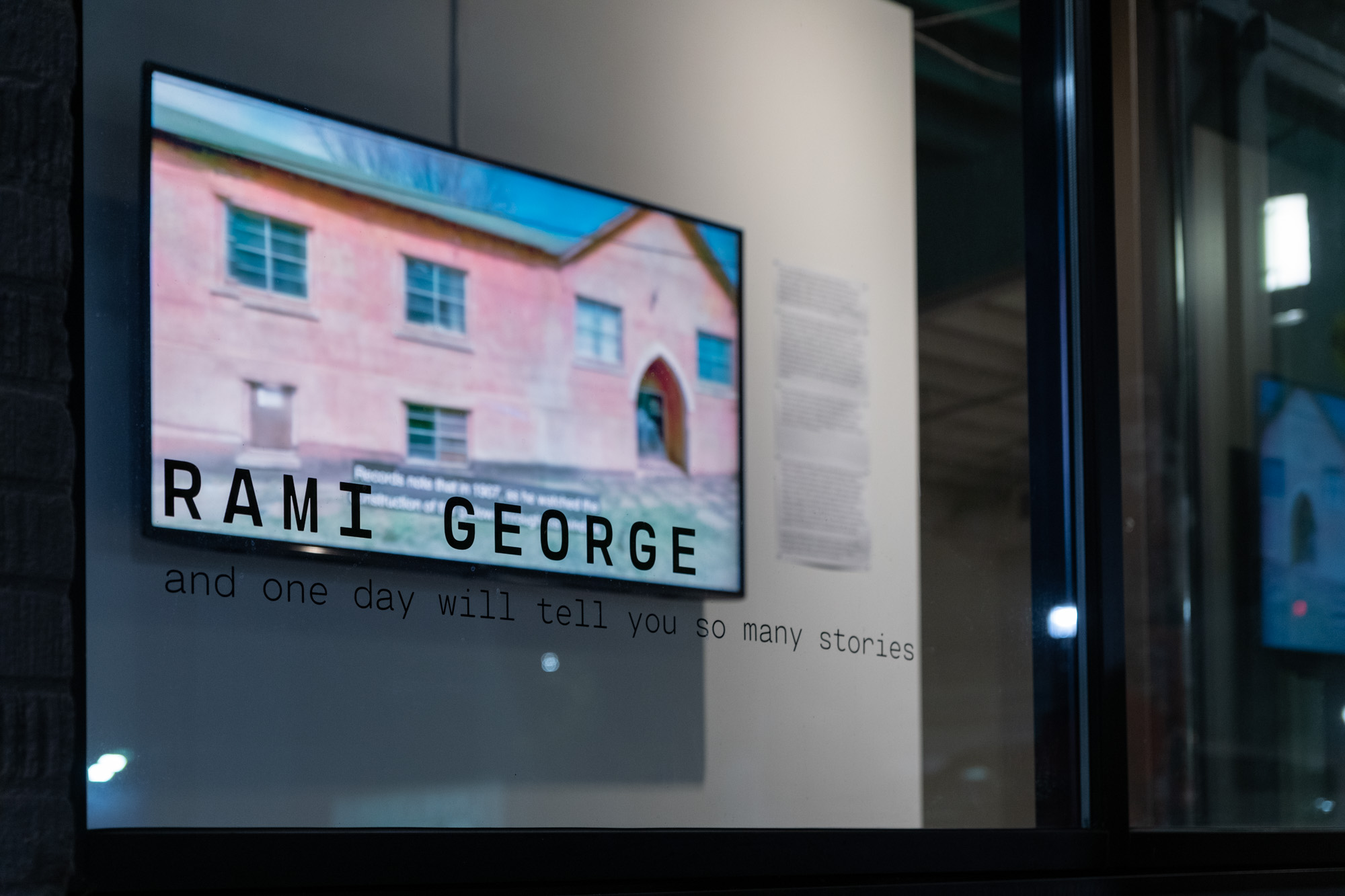 Window view with detail of Rami George, Untitled (Samaritan Foundation), 2014. HD video, color, sound, 5:46 min. 