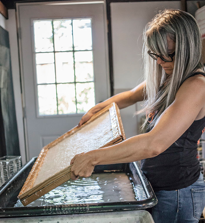 Jenene Nagy working in her studio