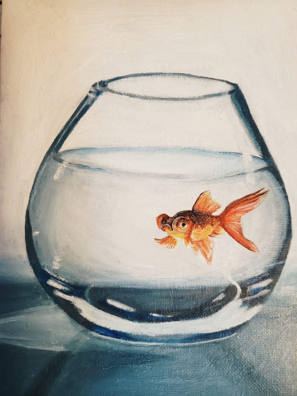 A painting in shades of blue featuring a glass cup and within it is the main focal point of an orange goldfish.