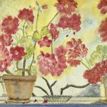 There are two red geraniums with a small glass dish between them. A few petals have fallen off too. The reflection of the afternoon winter sunlight on the window makes it hard to see there is a dogwood tree outside the window that is leafless but with buds.