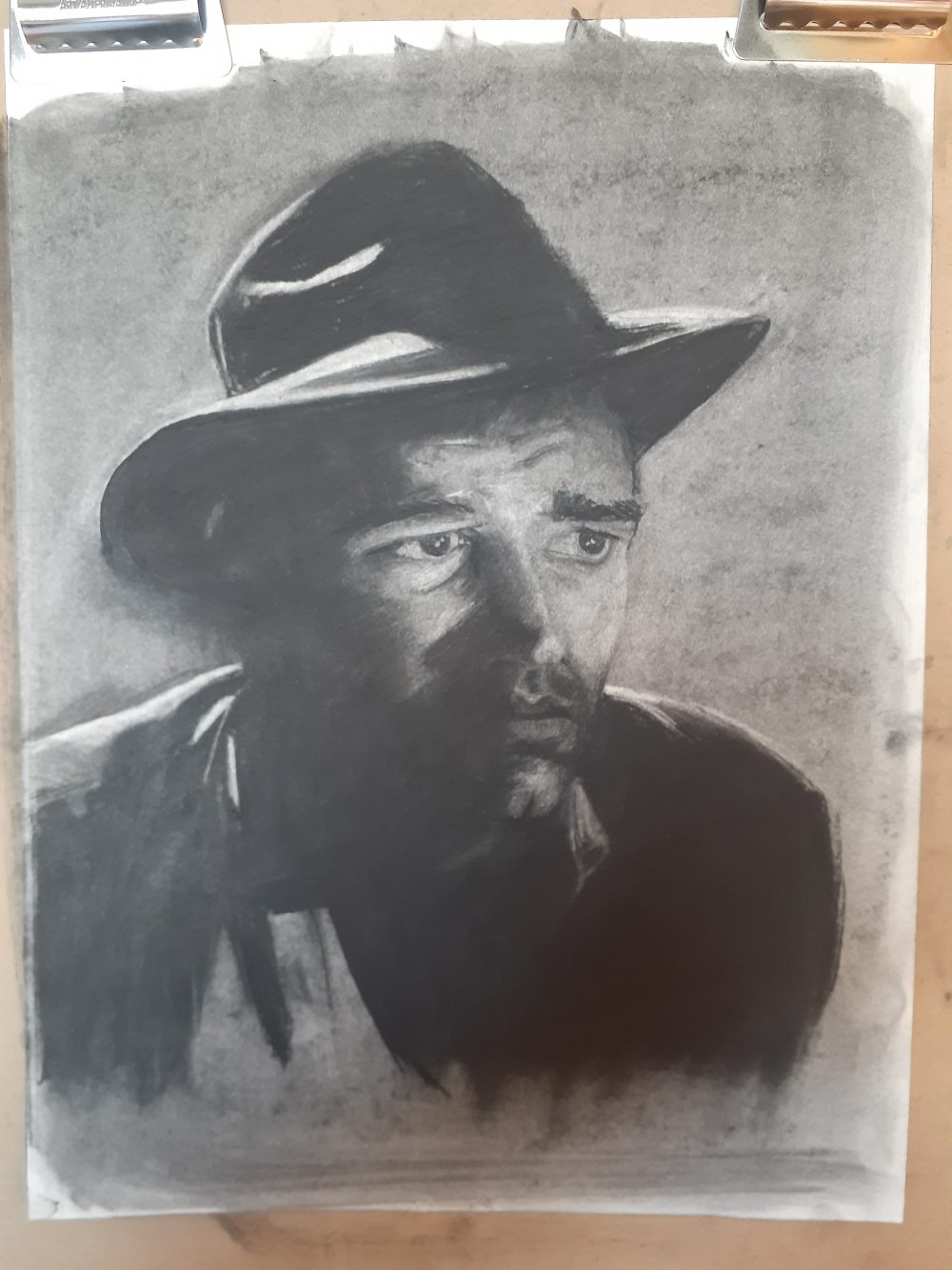 Black and white portrait of a man wearing a 1940's style hat.