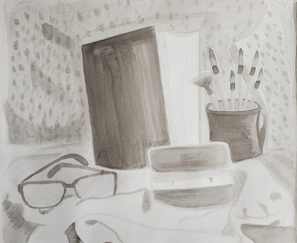 The favorite belongings of an artist, a towel to dry surfaces in the background, with a beloved book, a coffee cup, paint brushes, a candle and a pair of glasses.