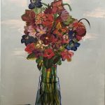 Colorful flowers painted with abstraction sit in a front of a light blue background on a wooden tabletop