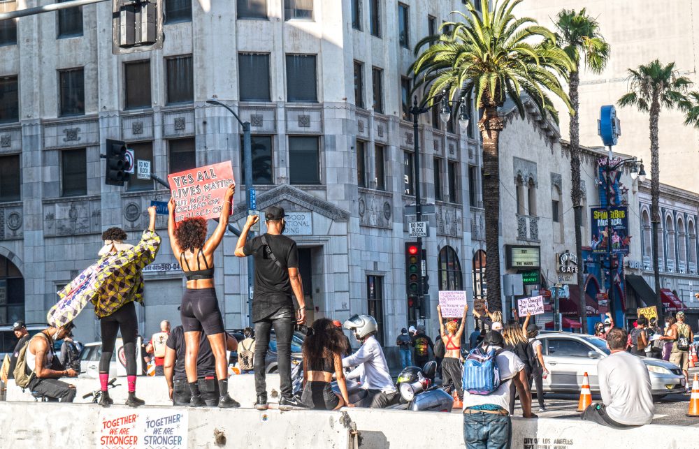 This photo is of a BLM protest in LA, California where protestors have blocked off Hollywood Blvd.