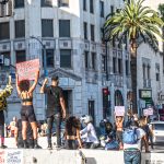 This photo is of a BLM protest in LA, California where protestors have blocked off Hollywood Blvd.
