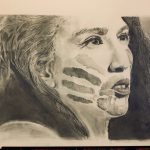 Portrait of a woman looking to the side with lines painted on her face.