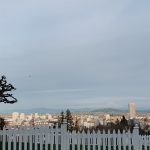 Overlooking Portland Oregon and all of the buildings. The mountain in the distance is filled with snow and the sun shining on the city on a cold winter day in 2021 is a beautiful sight to see.