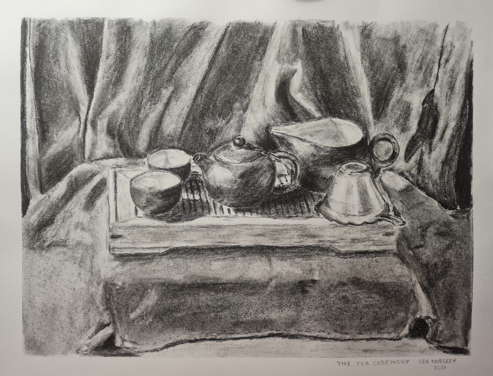 This is a still life showing a tea set for a chinese tea ceremony just before this ceremony would be started.