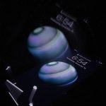 A photograph of shapes, letters, and numbers floating on a black background.