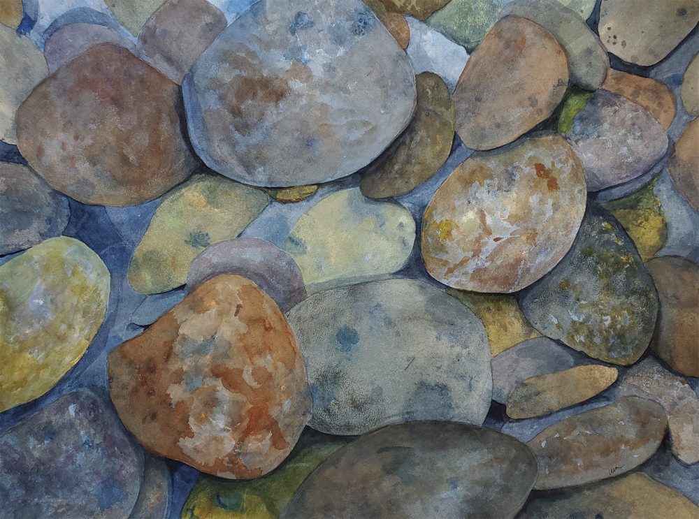 Multi-colored and textured river rocks.