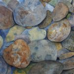 Multi-colored and textured river rocks.