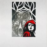 A print in black, gray, red, and white, with a woman wearing a red hood in the foreground, looking over her shoulder to see a large wolf behind her. In the background is a dark forest.