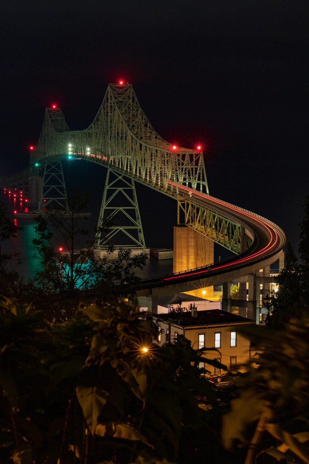The Astoria-Megler bridge at night with light trails.