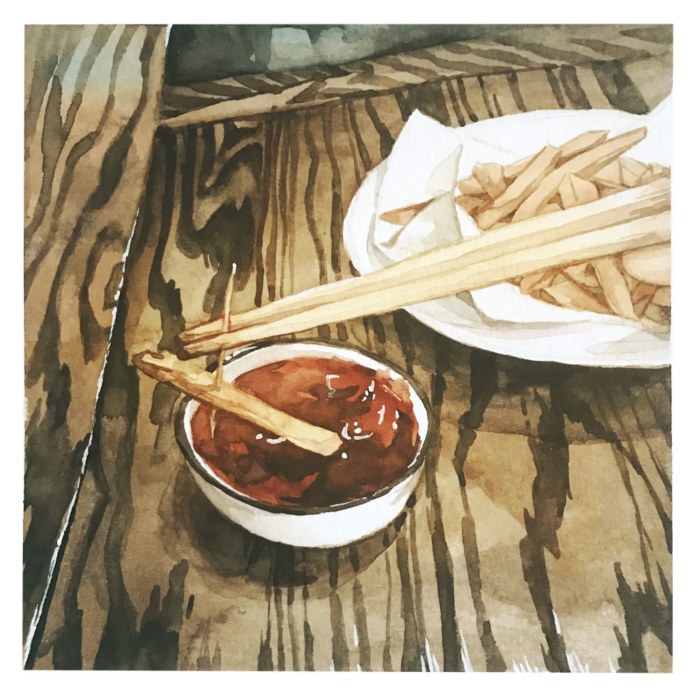French fries and chopsticks with a toothpick used to dip the fry in ketchup.
