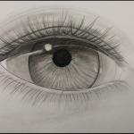 A drawing of a young woman's eye in black and white.