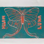 This piece is of a Luna moth, and the left side says Moth, and the right side says Luna.