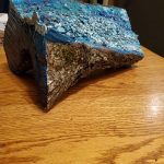 Sculpture of a log formed to look like water.