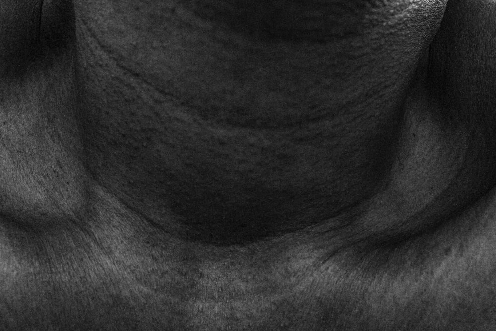 Self-portrait depicting the lines about my neck and collar bone inspired by Buddhist Thangka iconography.