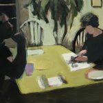 A man is sitting at a dining room table at night while across from him, a woman slices gimbap.