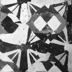 Image has a triangular shaped repeating pattern, but each repeat is different (for example, different in color or different in what part of the shape got repeated). There is also a 50's car in the middle.