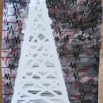 A drawing with a black and gray background with heartbeat vitals, a white tower in the middle, and red paint smeared all over the background.