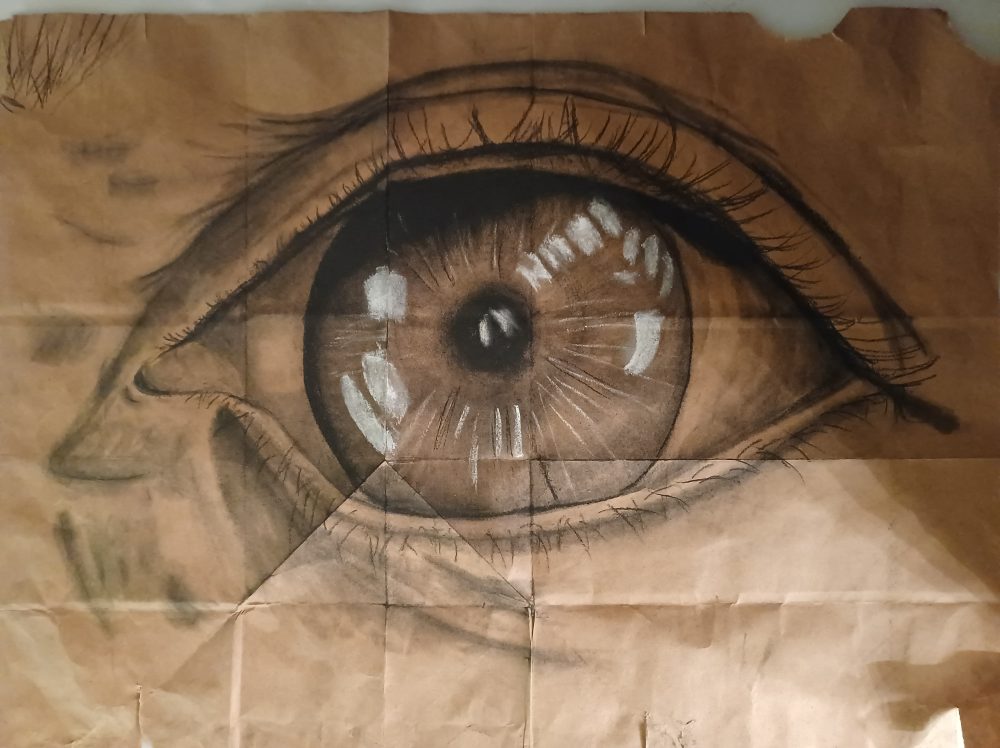 A large, realistic, close-up drawing of an eye.