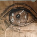 A large, realistic, close-up drawing of an eye.