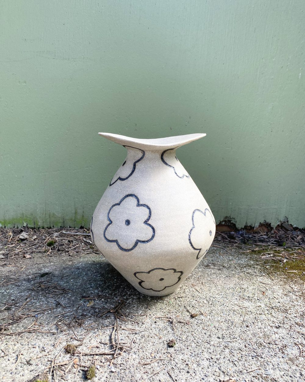 Flower vase with floral carvings