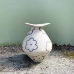 Flower vase with floral carvings