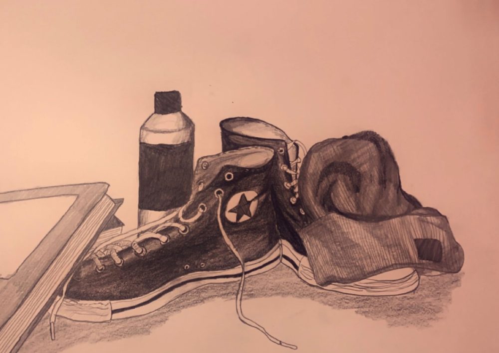 A still life drawing of some random objects in the corner of my room which include, a water bottle, some books, my shoes and a beanie.