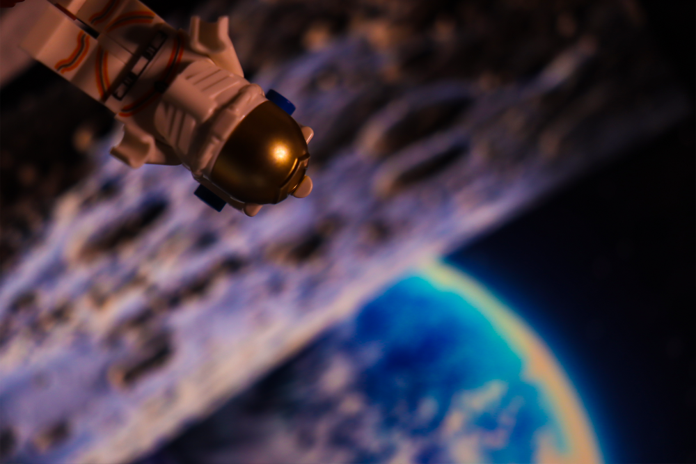Digital photograph of astronaut hovering above the earth.