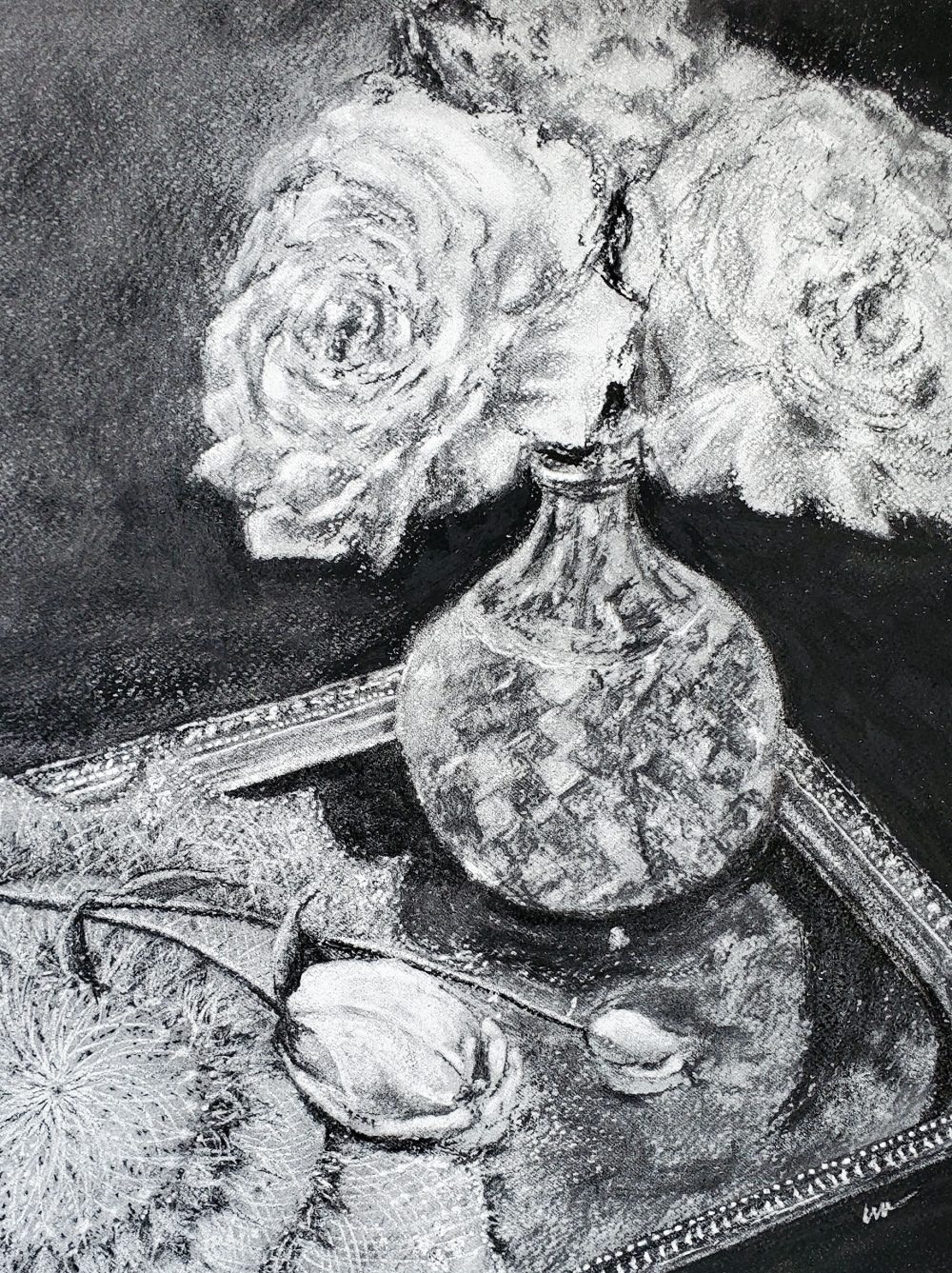 A charcoal drawing featuring a silver tray containing a faceted glass vase with three roses in full bloom and two rosebuds placed on a lace doily against a dark background.