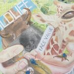 A color drawing that includes animals, being held in a hand that is diproportionately large.