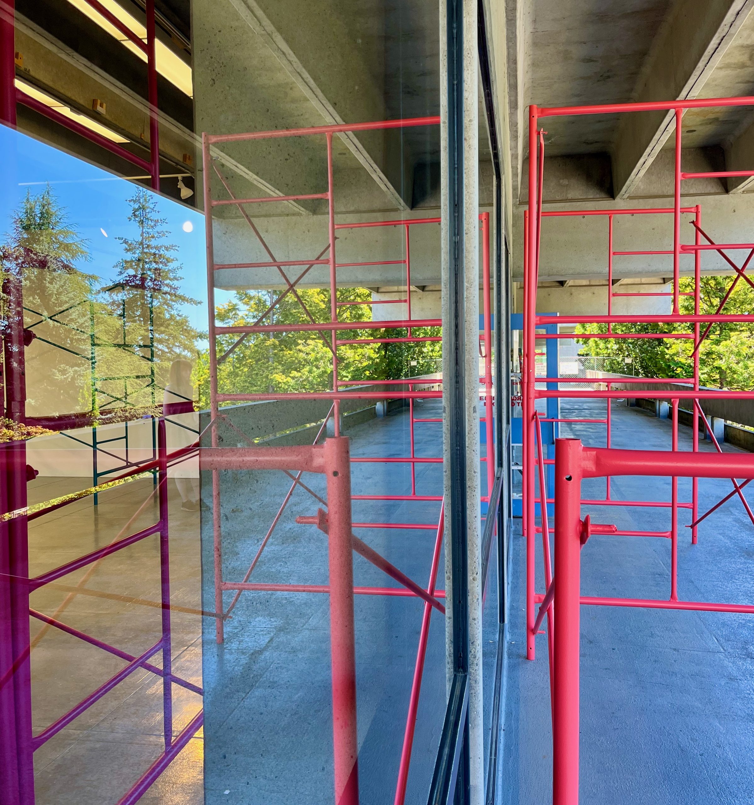 Pink scaffolding outside near the gallery window.