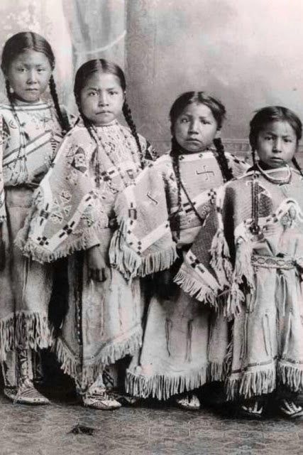 Photograph of four young Native American girls.